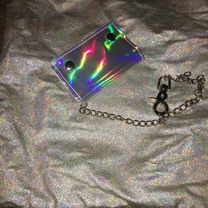 Holographic string backpack and wallet